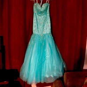 Never worn still has tags!!! Aqua blue mermaid style prom dress